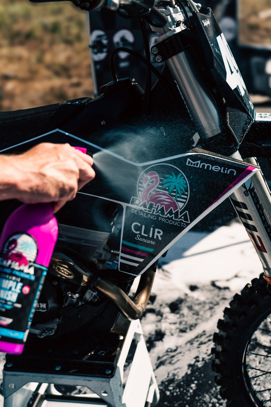 Spraying Bahama Simple Finish on a dirt bike