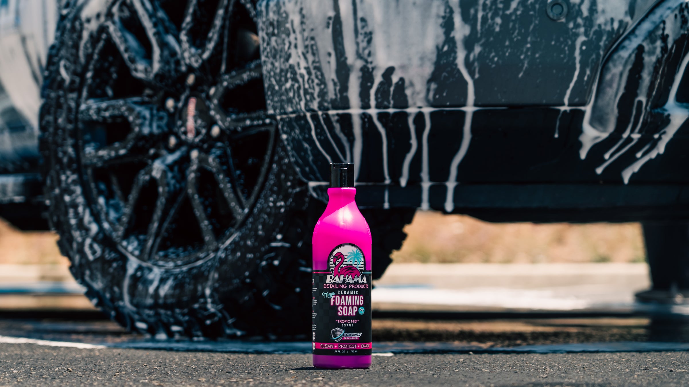 Bahama foam soap bottle beside a truck wheel