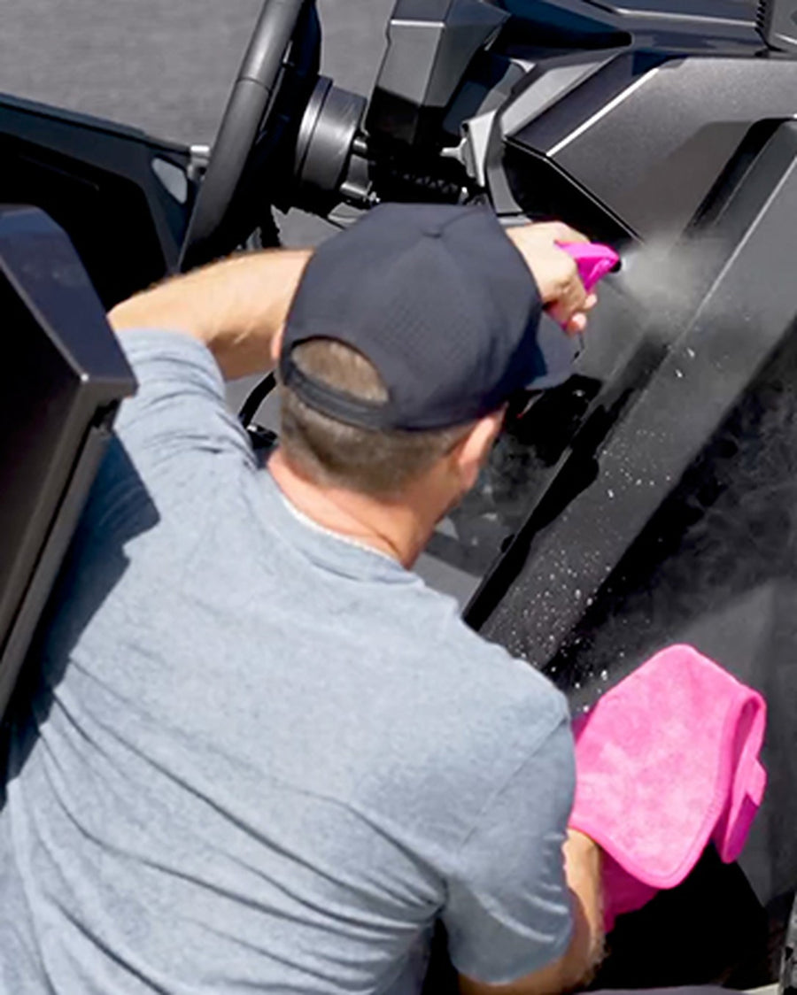 Detailing a UTV with a Bahama spray and pink microfiber towel