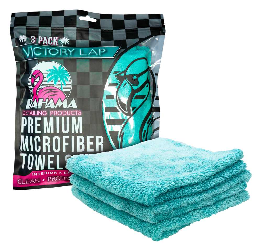Victory Lap pack beside a stack of aqua 450 GSM plush microfiber towels